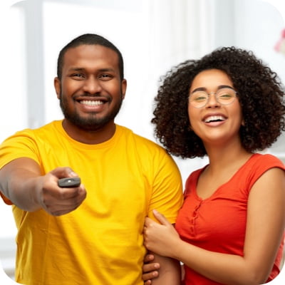 Couple holding a remote