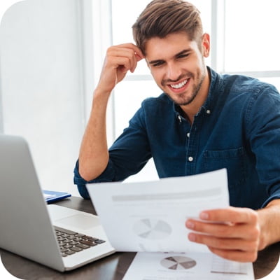 Happy guy looking at chart