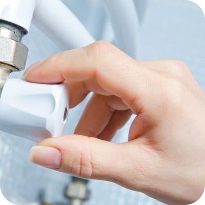 Hand turning a valve